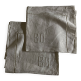 Pair of modernist linen pillowcases embroidered with comic strips