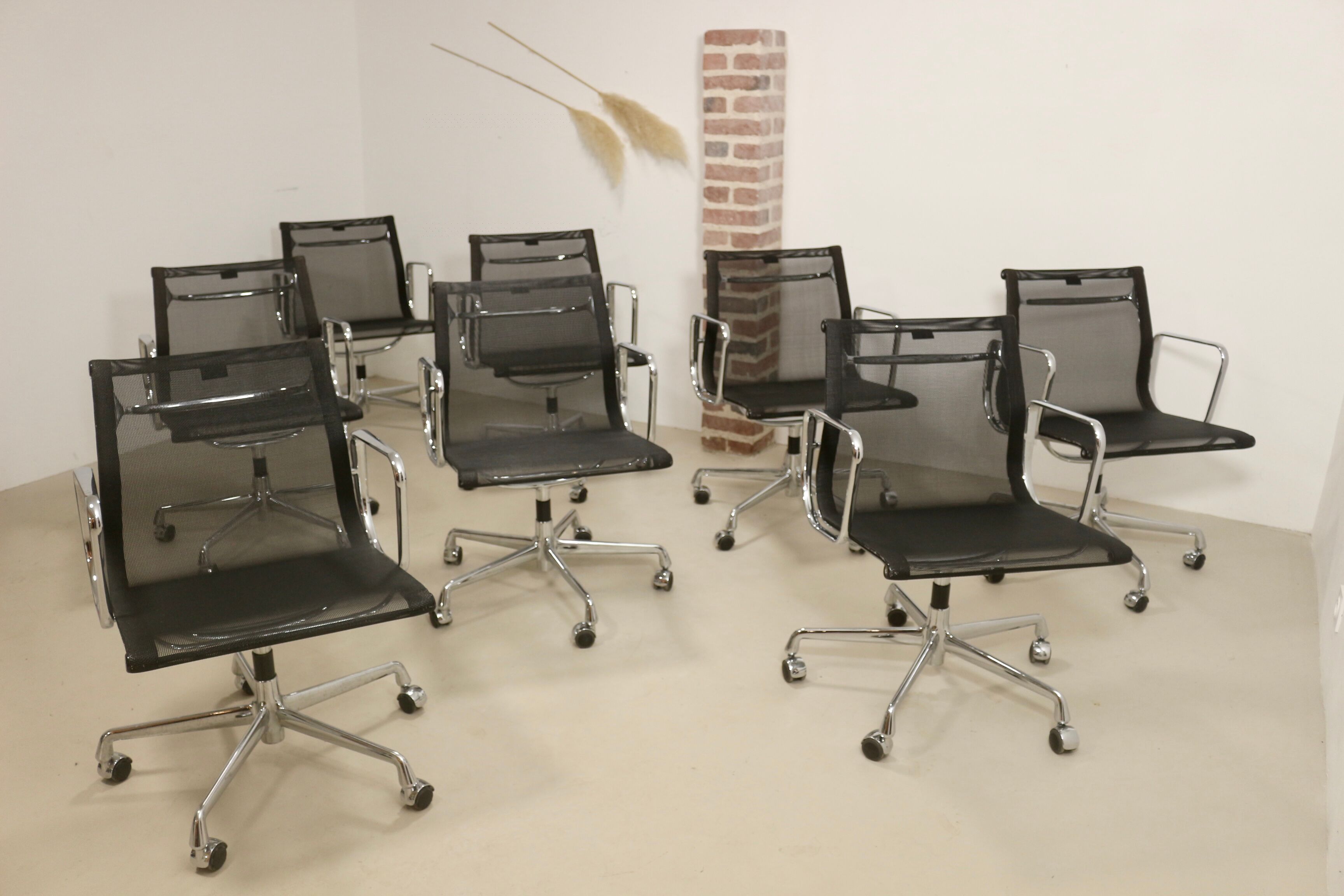 Set of 8 Charles and Ray Eames armchairs by Vitra model EA 117