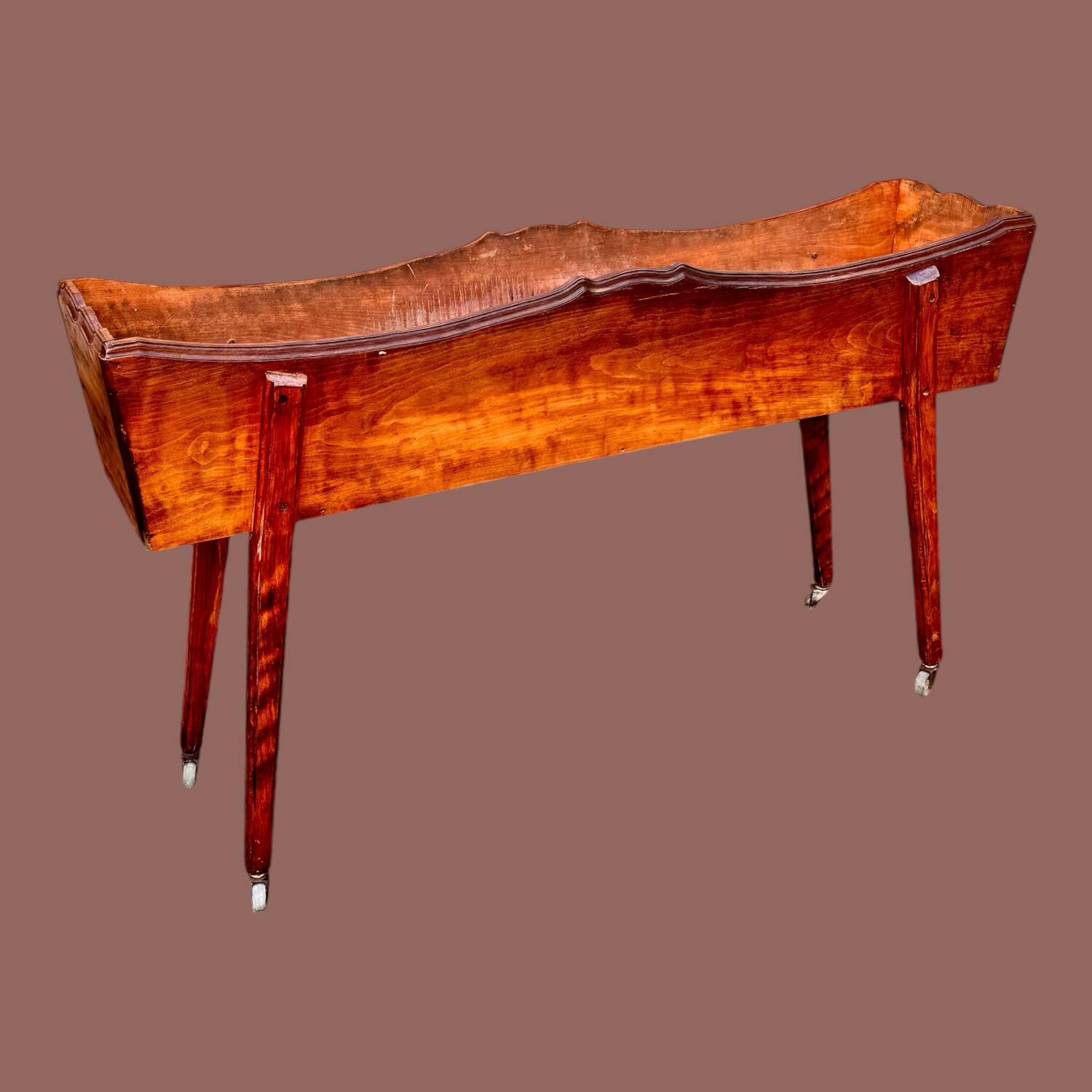 Old indoor planter on wheels