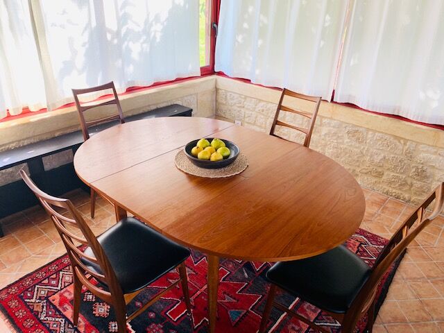 Expandable teak dining table, butterfly extension, circa 60s
