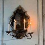 Gold metal wall mirror, in the style of Maison Baguès, Paris circa 1950.