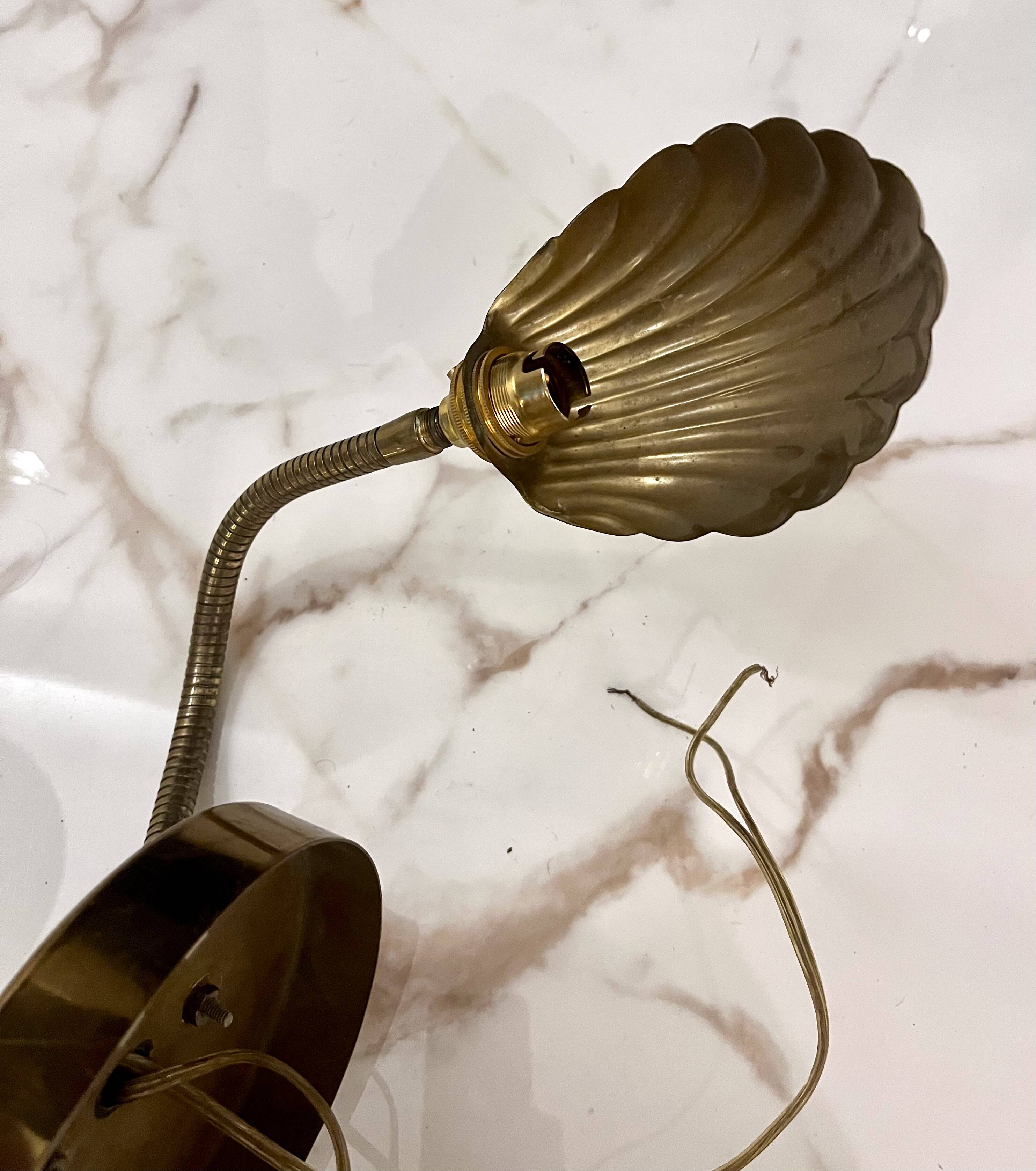 Articulated shell wall light