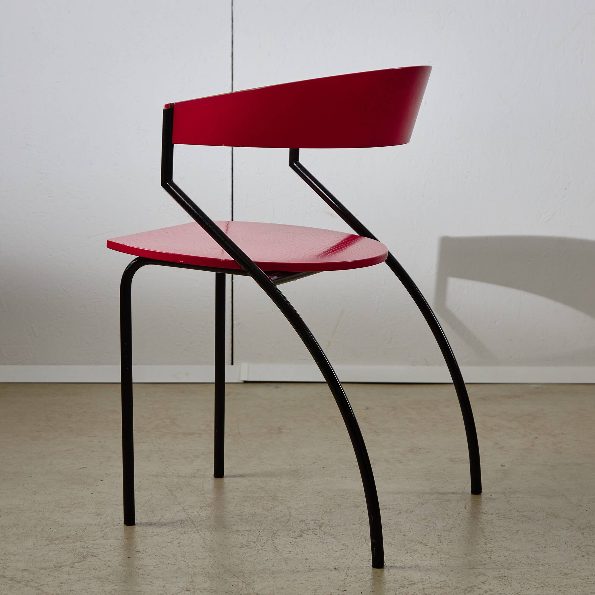 Red Plywood and Curved Metal Frame Chair