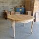 Round table made of cherry wood, sanded and varnished.