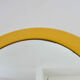 Round wall mounted mirror in yellow plastic 1970