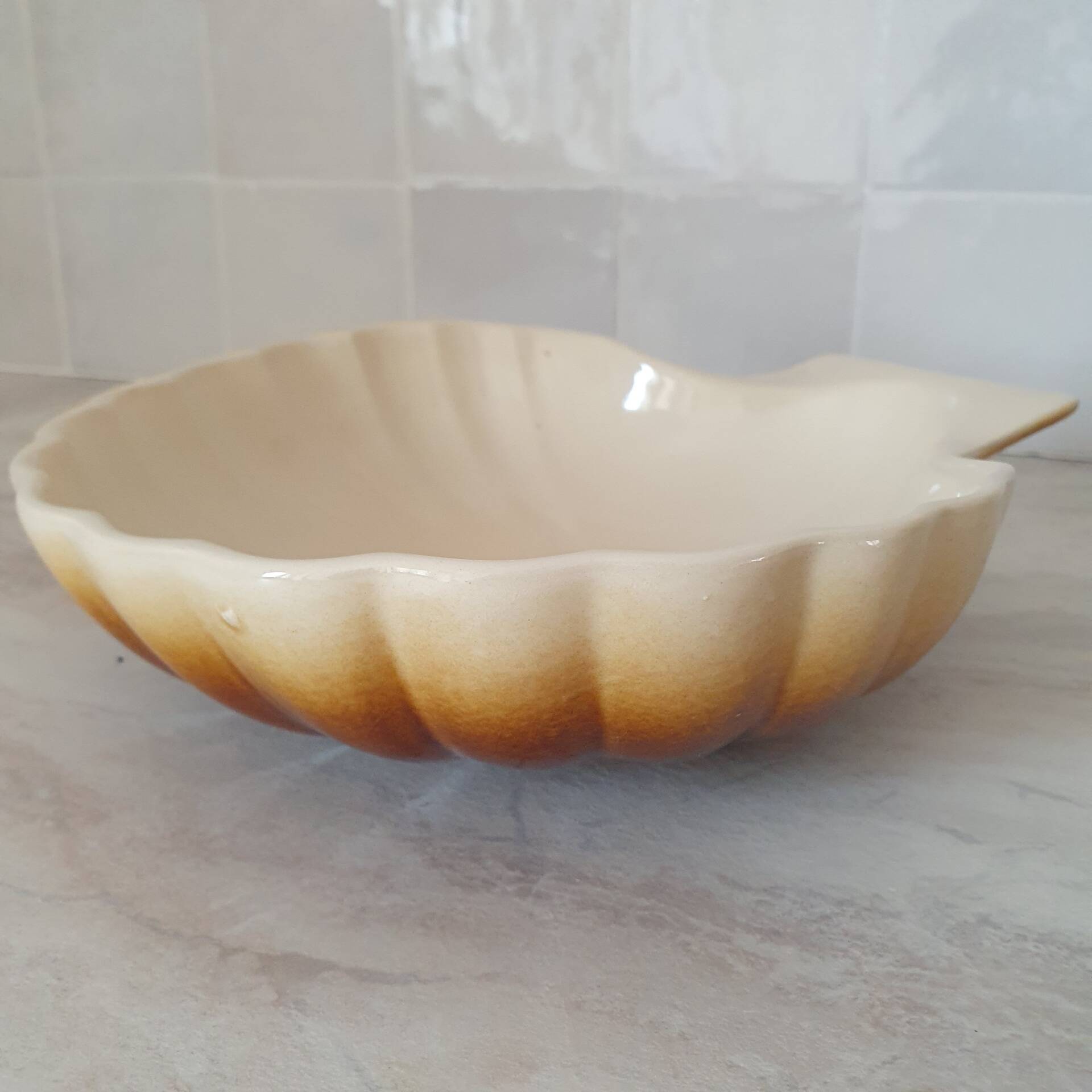 Brown and white ceramic shell bowl