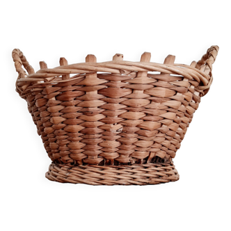 Old rattan basket with braided handles