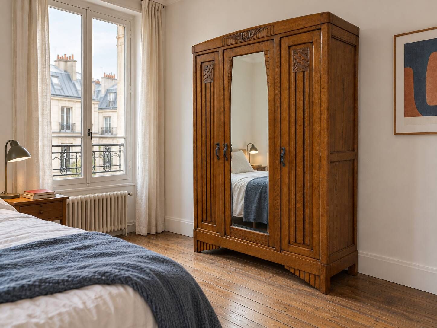 Art Deco oak wardrobe with three doors and bevelled mirror.