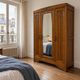 Art Deco oak wardrobe with three doors and bevelled mirror.