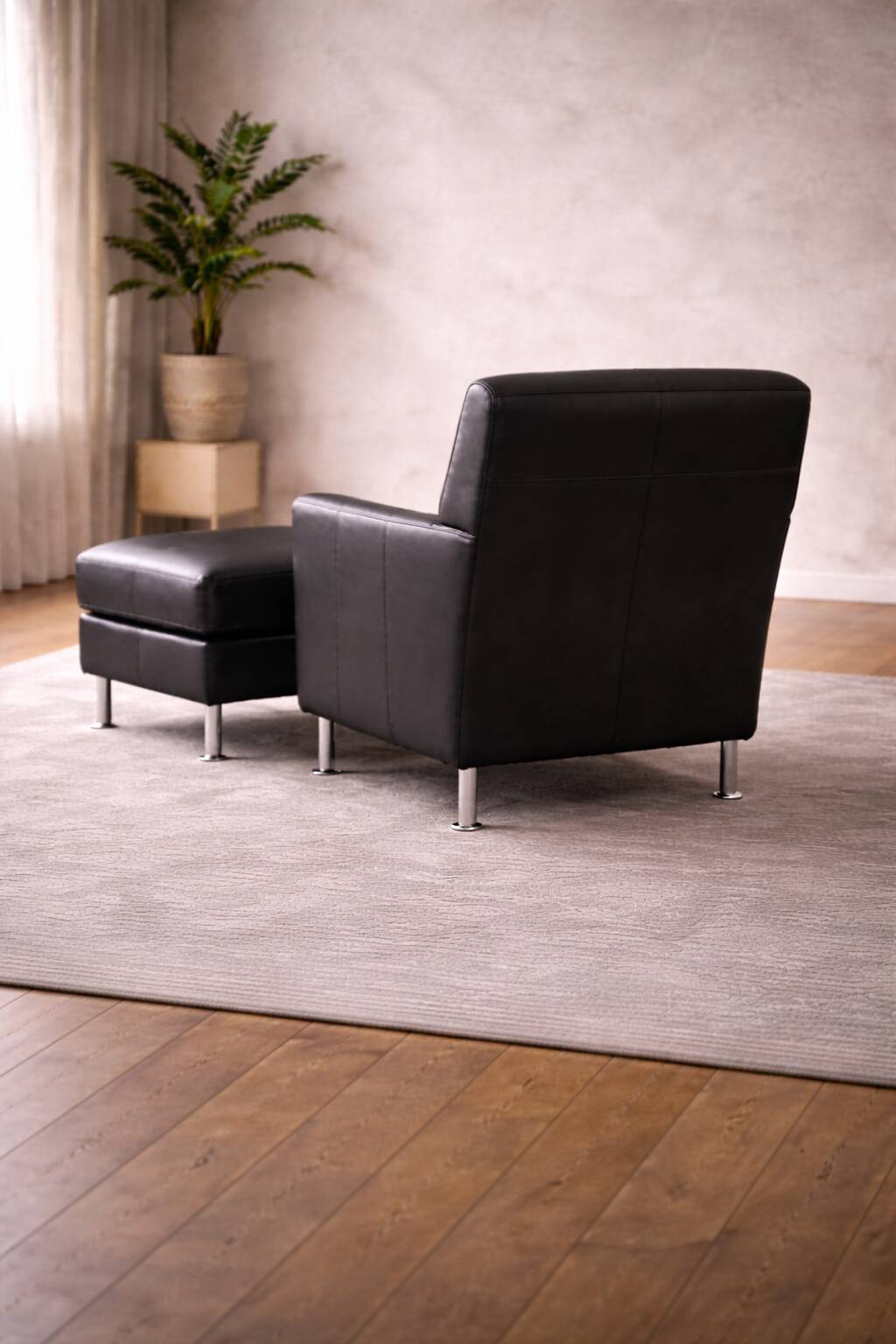 Modern Lounge Armchair with Matching Footstool — Black Leather
