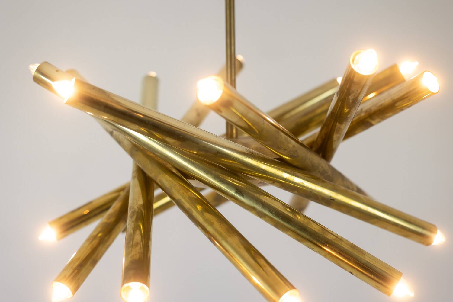 Pair of matte gold-plated brass chandeliers. Italian work from the 1970s.