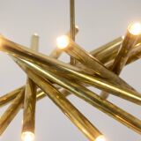 Pair of matte gold-plated brass chandeliers. Italian work from the 1970s.