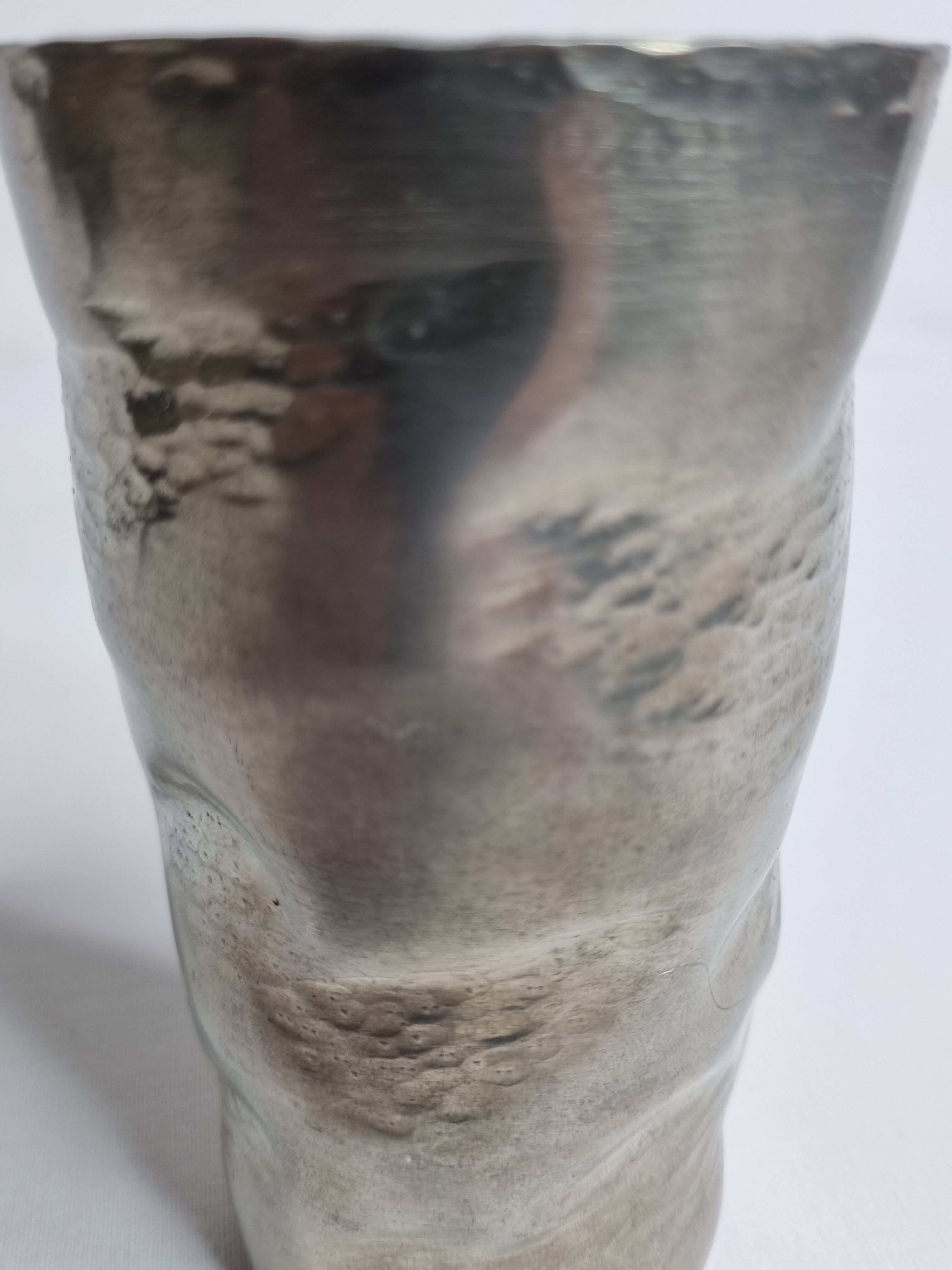 Hammered tin cup, signed