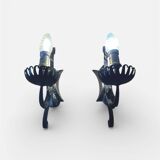 Vintage wrought iron wall lights in rustic gothic style.