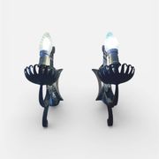 Vintage wrought iron wall lights in rustic gothic style.