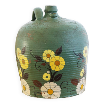 Old terracotta jug painted green