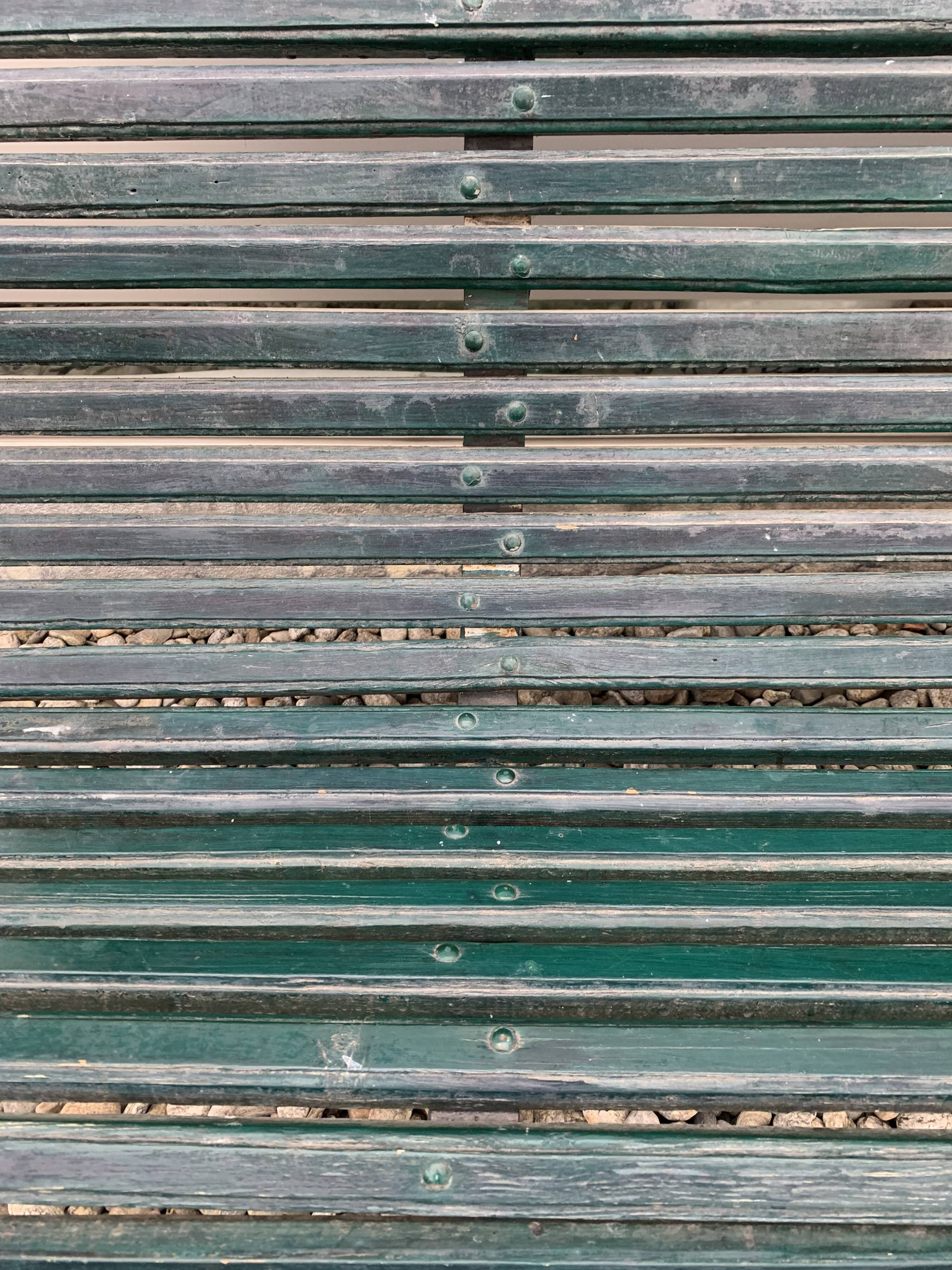 Garden bench in metal foot slats