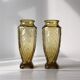 Duo of art deco vases in yellow glass with scroll patterns