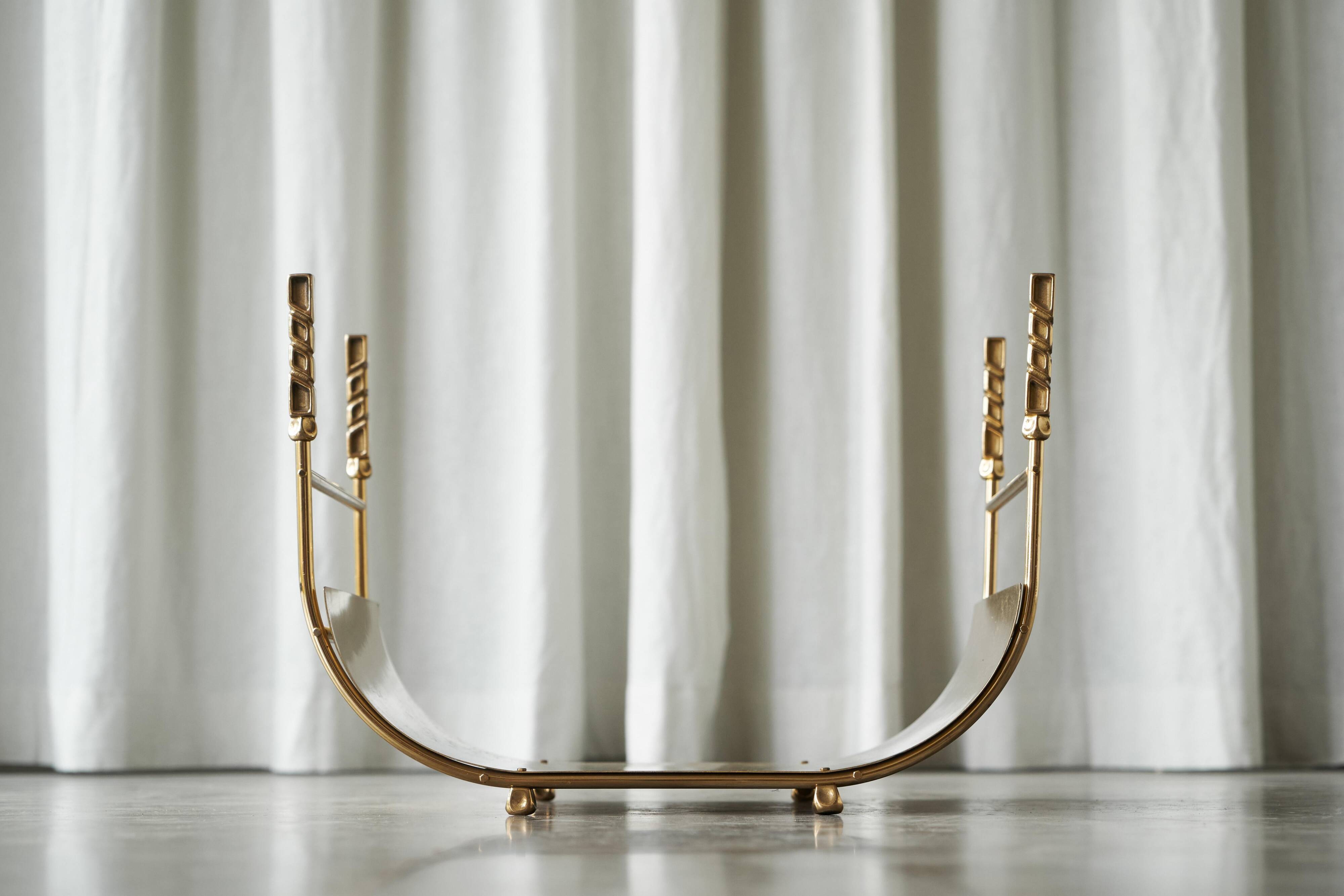 Sculptural brass magazine rack or basket from the 1970s.