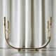 Sculptural brass magazine rack or basket from the 1970s.