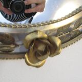 Round gold metal mirror, rose crown