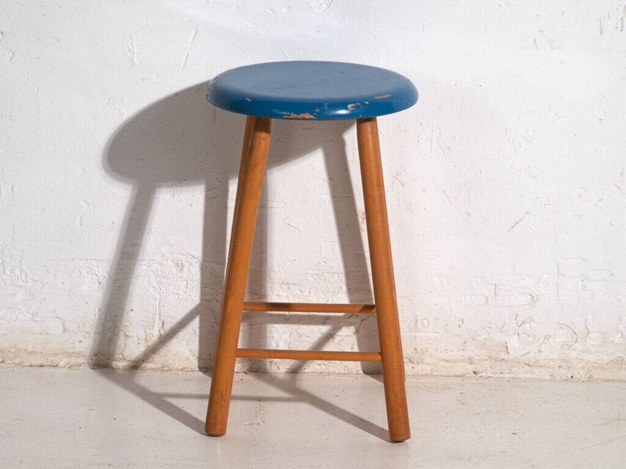 Antique wooden stool with a round seat – Central Europe, around 1950