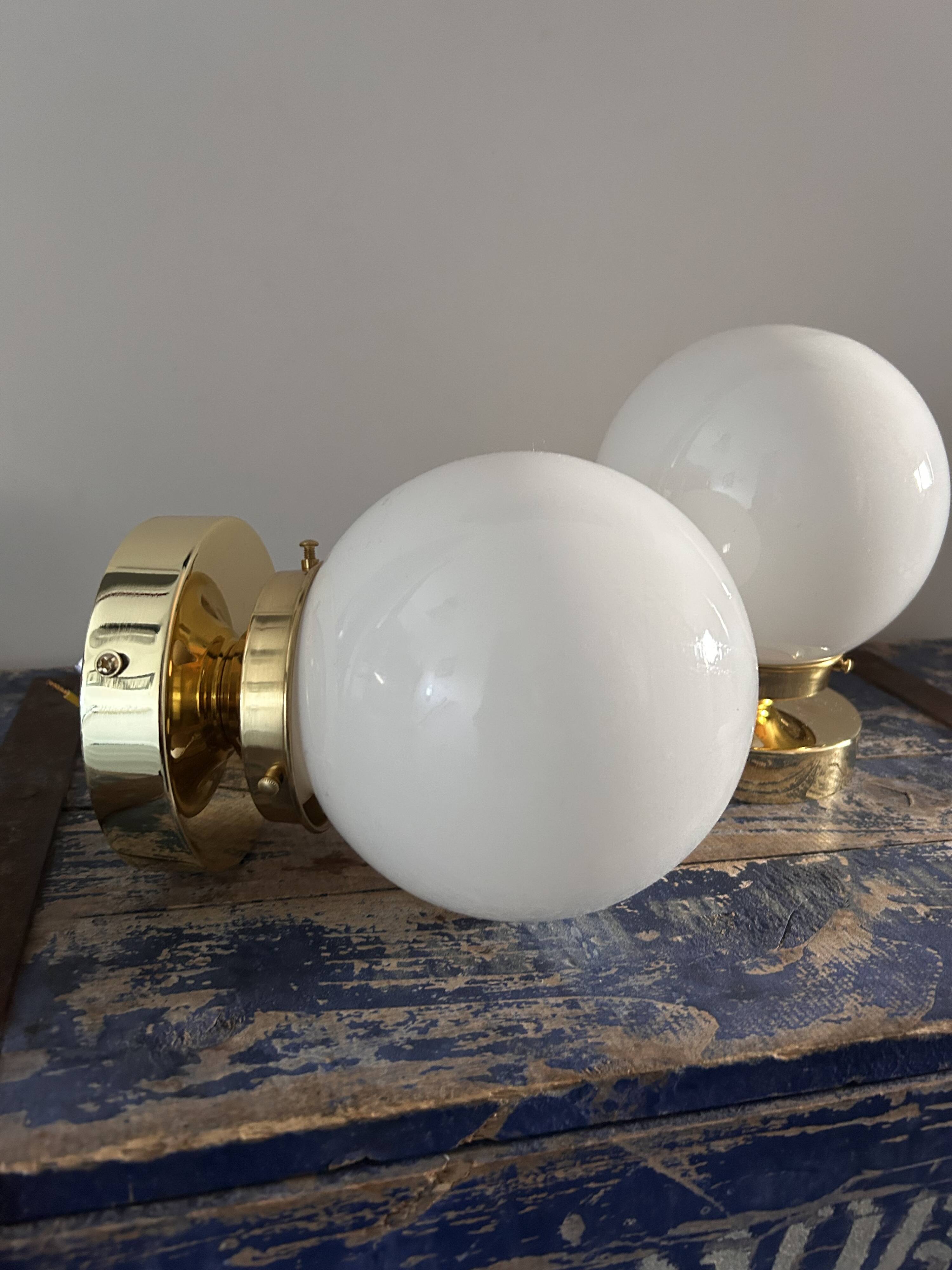 Set of white opaline globe sconces