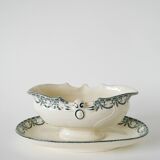 Sauce boat in Salins Iron Earth, "Guirlandes" model, textured version, early 20th century