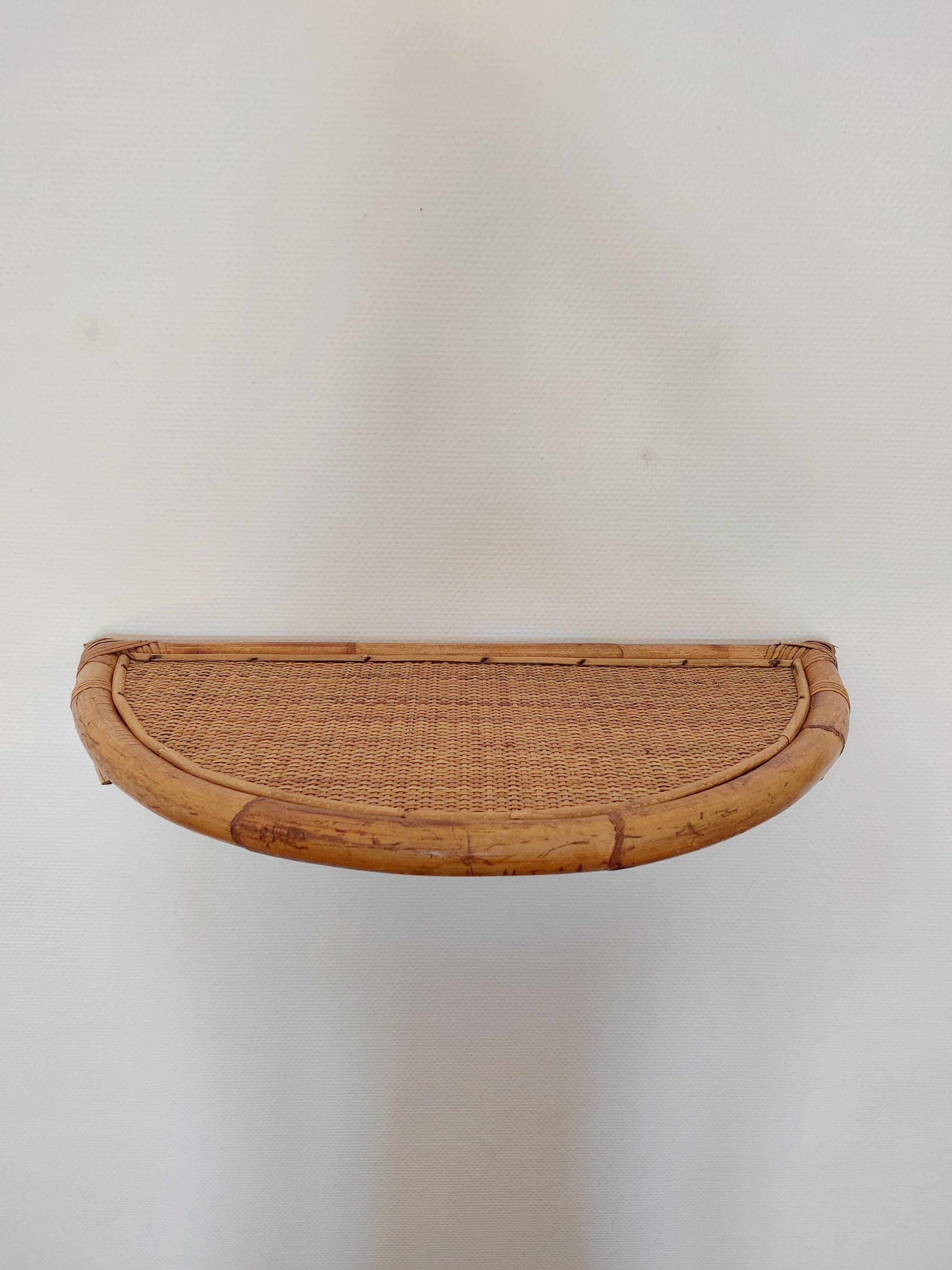 Vintage half-moon rattan shelf