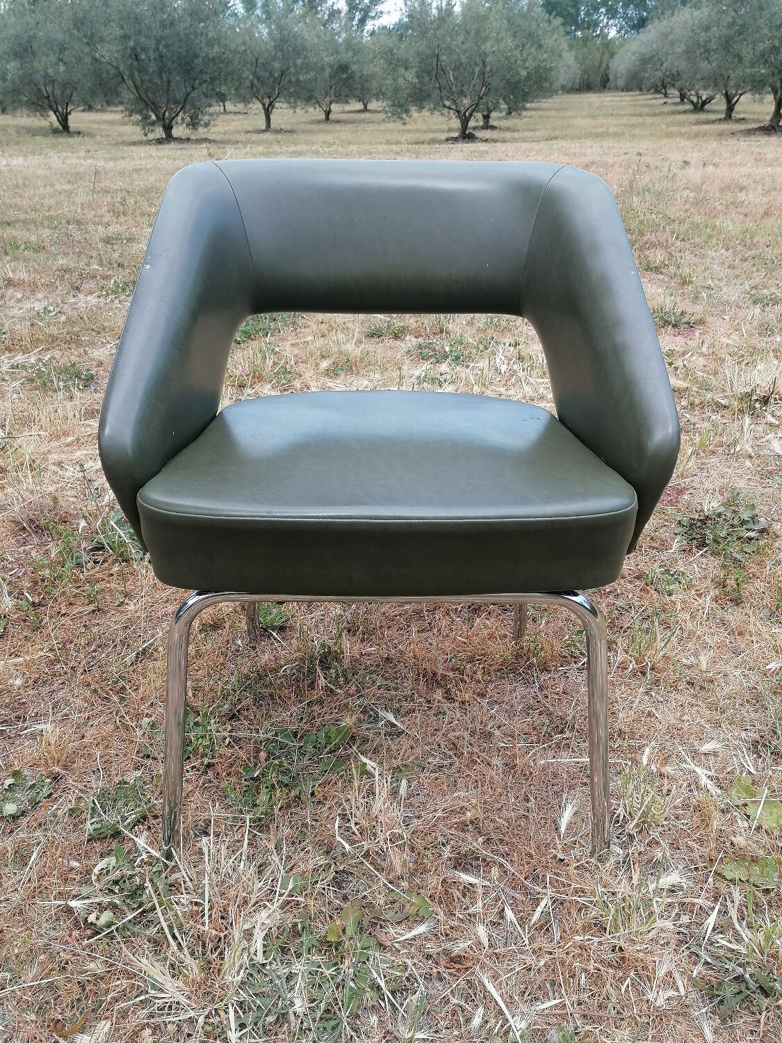 Vintage conference armchair in green skai Roset SNA