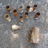 Service mazagrans and decanter in enamelled stoneware.