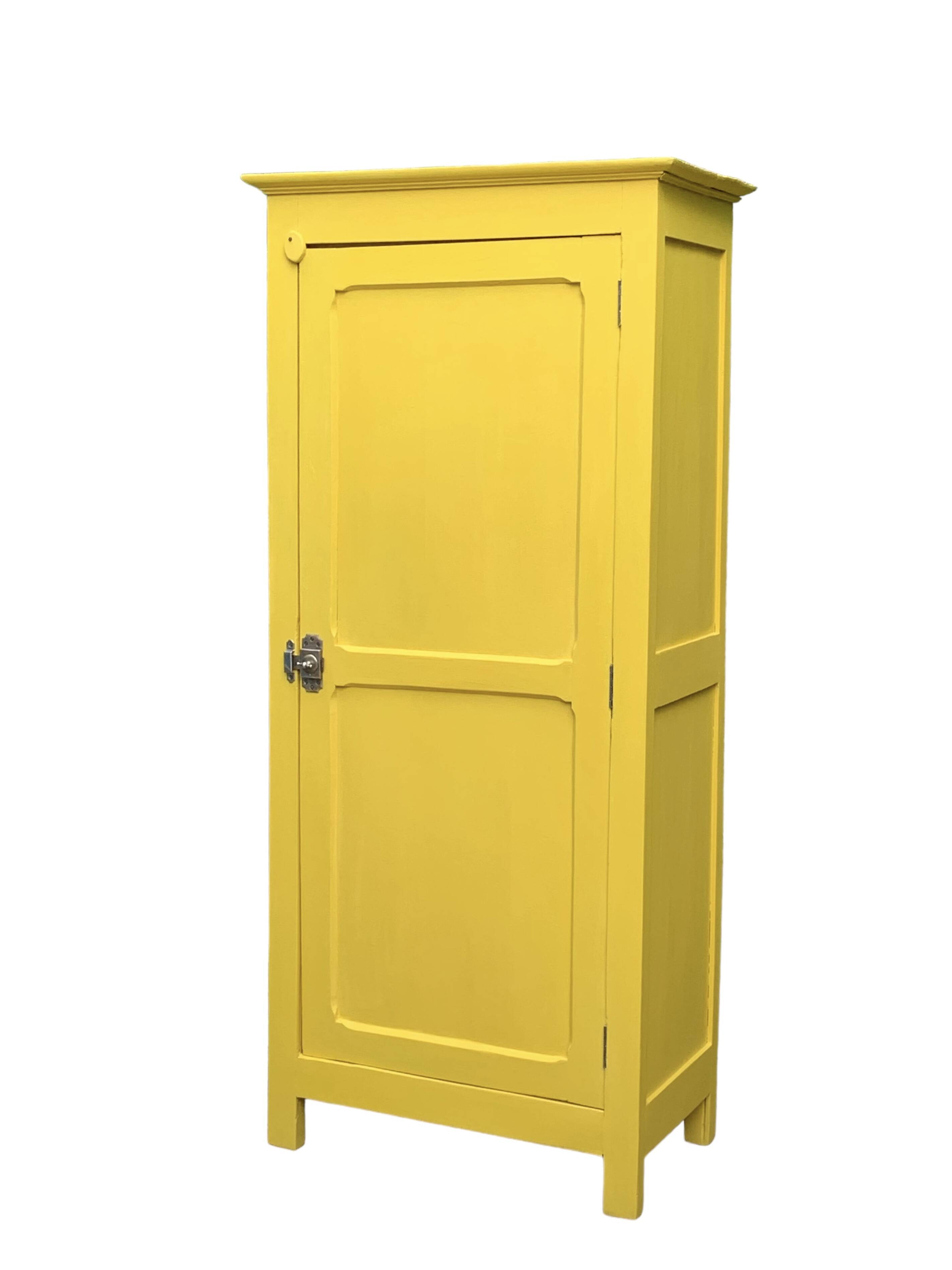 Antique powder yellow Parisian bonnetière wardrobe.