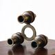 Tripod candle holder in wood and brass, Germany, 1960s/70s