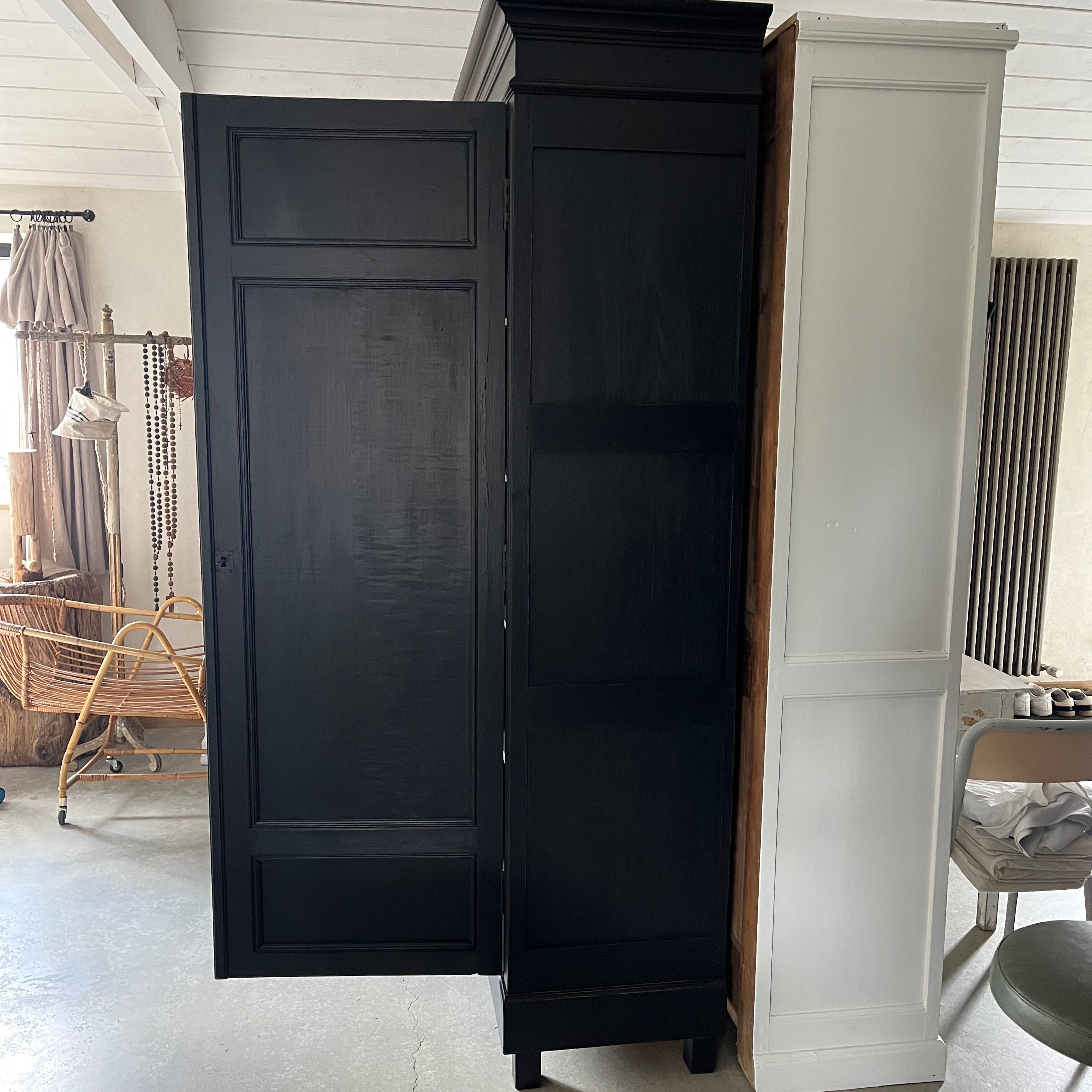 Large black wooden wardrobe