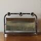 Vintage wall-mounted coat rack in chrome metal with integrated mirror and hat rack