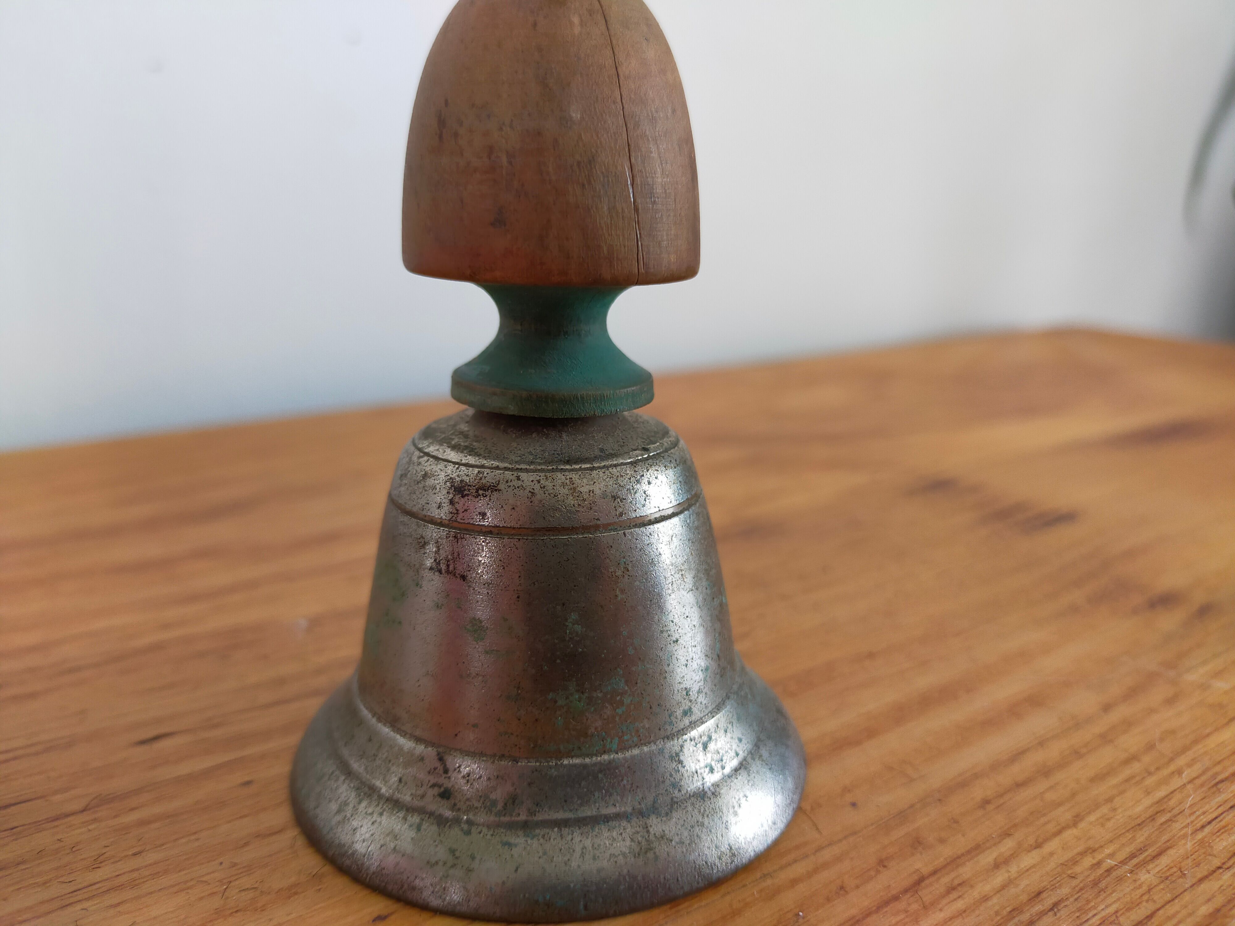 Vintage metal bell and wooden handle