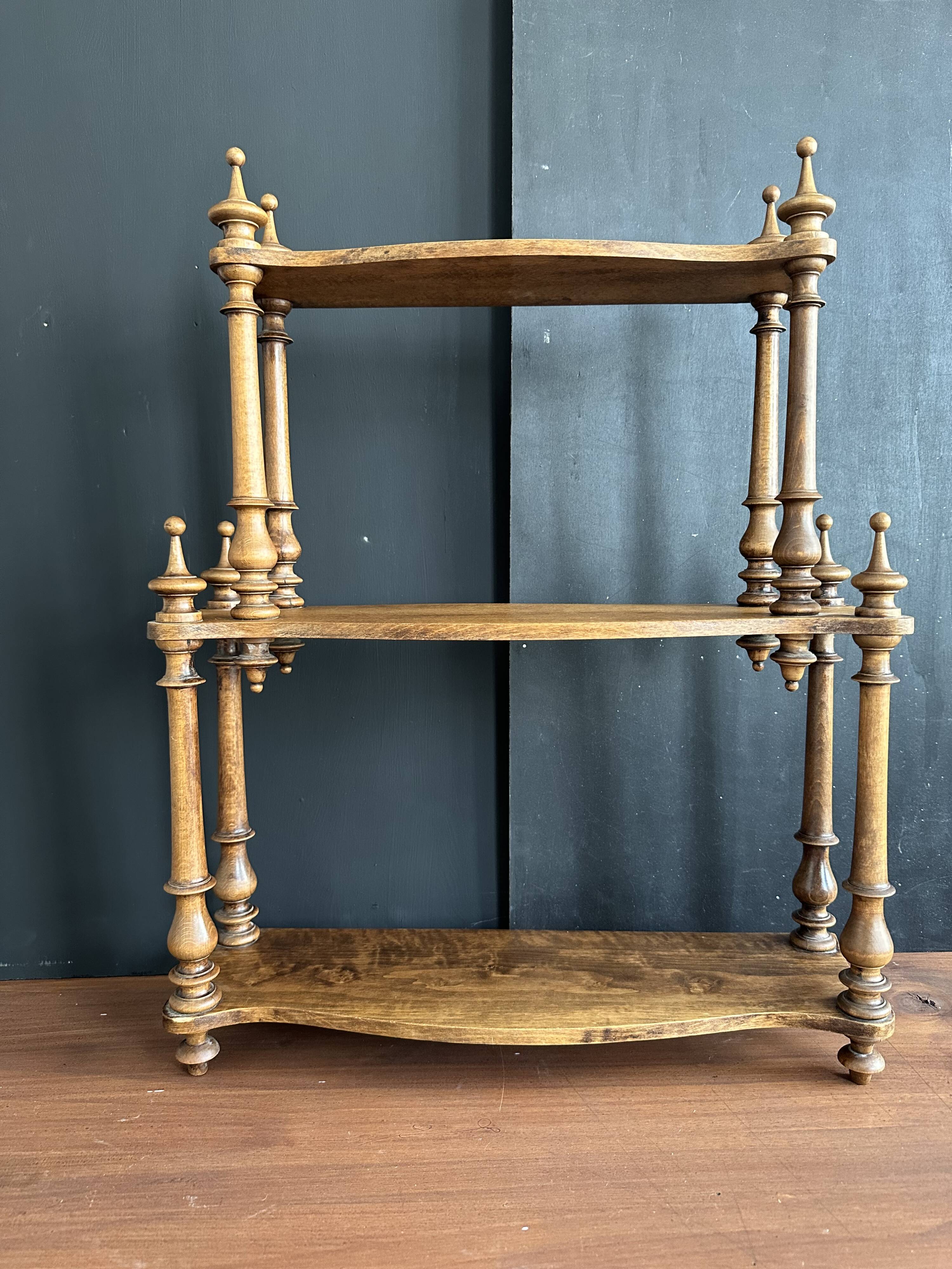 Antique turned wooden shelf with three levels, around 1900.