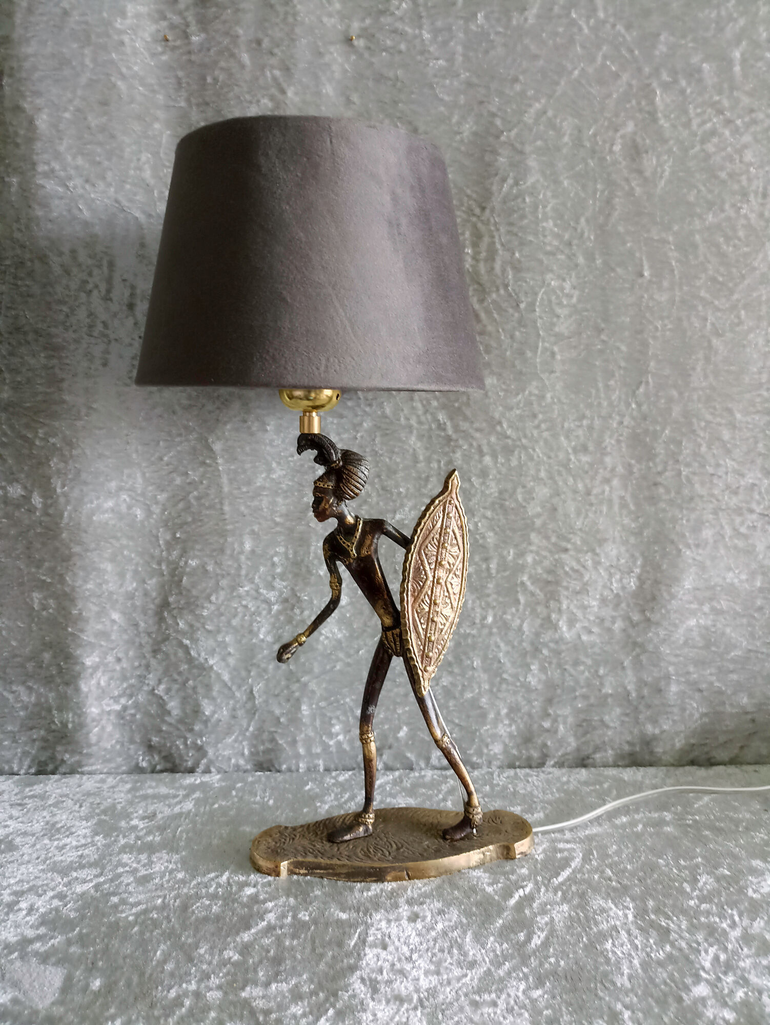 African warrior lamp in bronze.