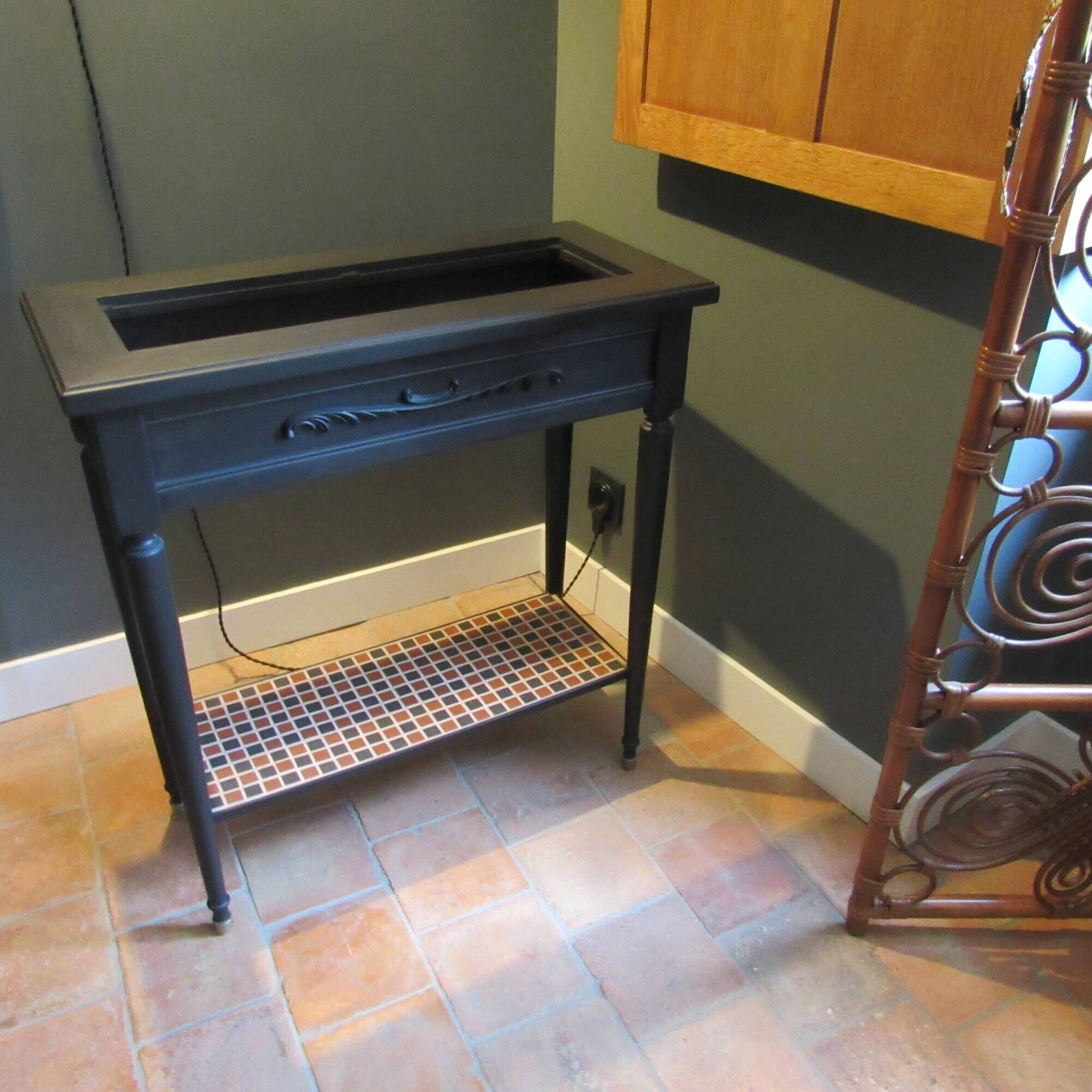 Vintage planter on wheels made of oak, repainted in black.