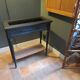 Vintage planter on wheels made of oak, repainted in black.
