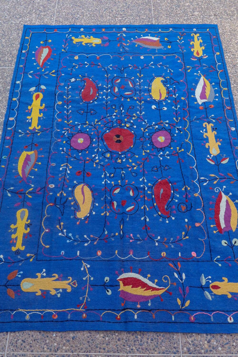 Midnight blue suzani kilim rug with embroidered patterns