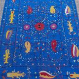 Midnight blue suzani kilim rug with embroidered patterns
