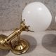 Pair of brass boat swivel appliques - opalin glass globe