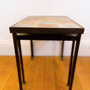 Nest tables in ceramic and metal