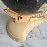 French mid-century school globe with black oceans on printed paper, cream plastic base