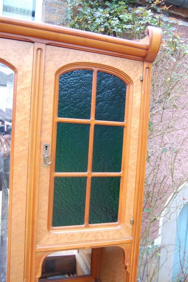 Art Nouveau mirrored wardrobe in mottled maple from the 1930s.