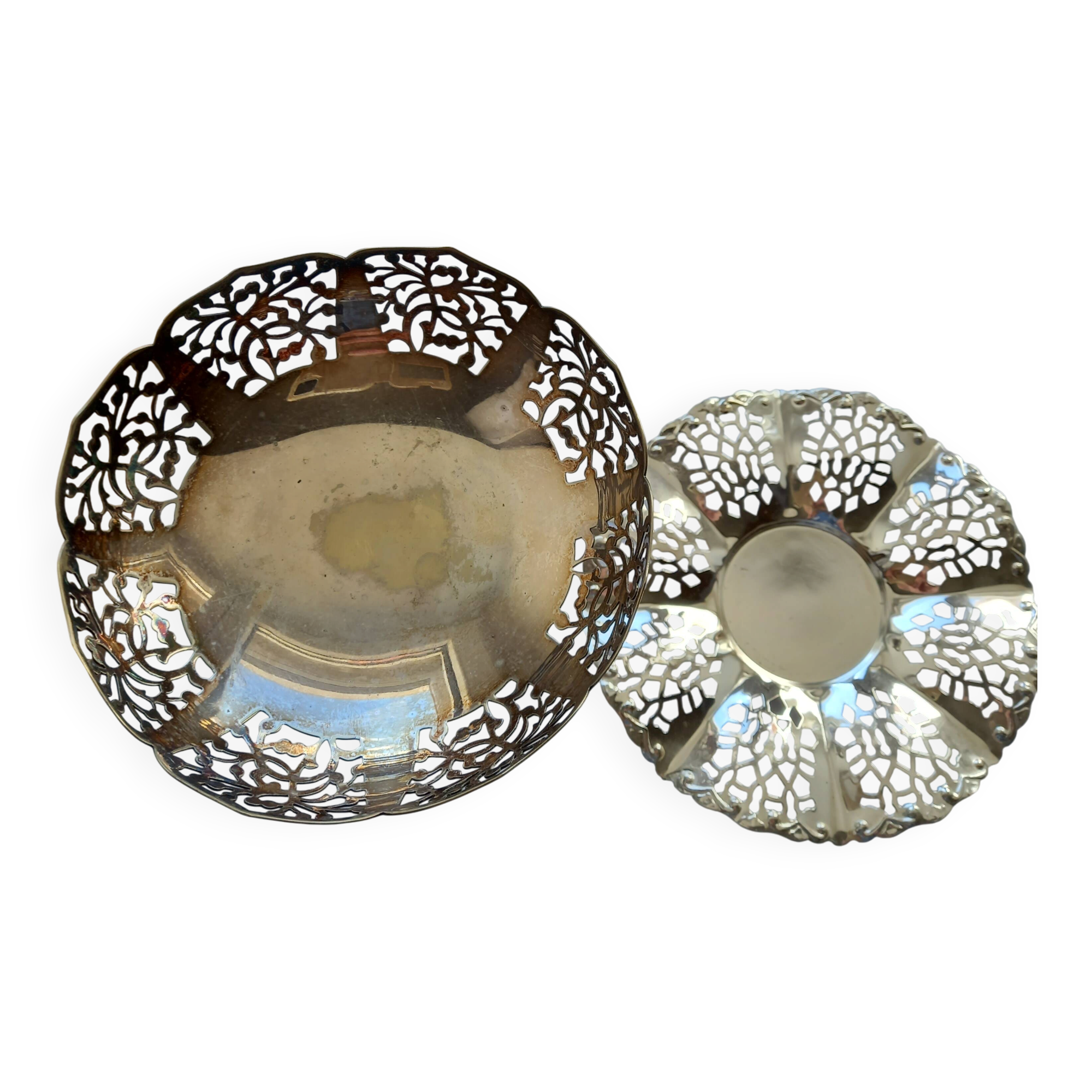 Two metal cups with an openwork design.