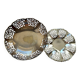 Two metal cups with an openwork design.