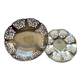 Two metal cups with an openwork design.