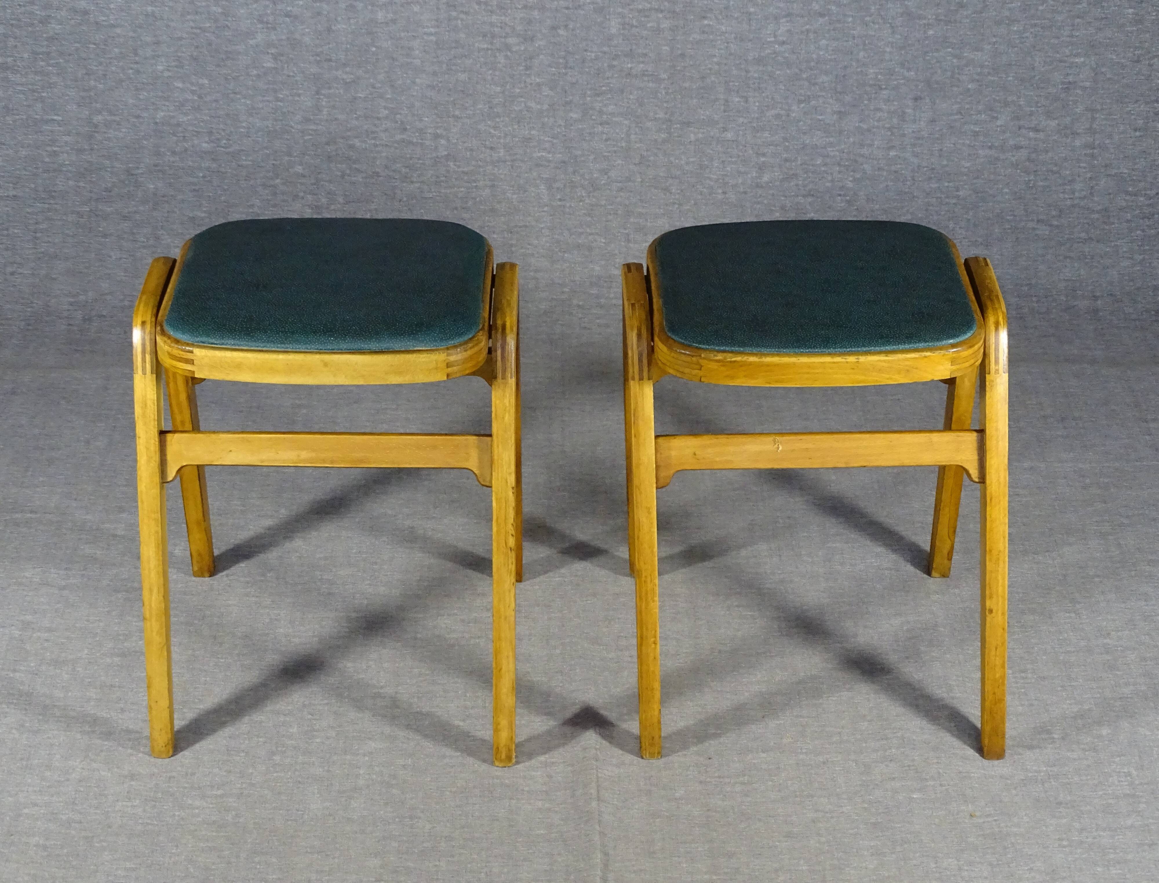 2 Mid-century green vinyl stools with compass legs from the 1960s.